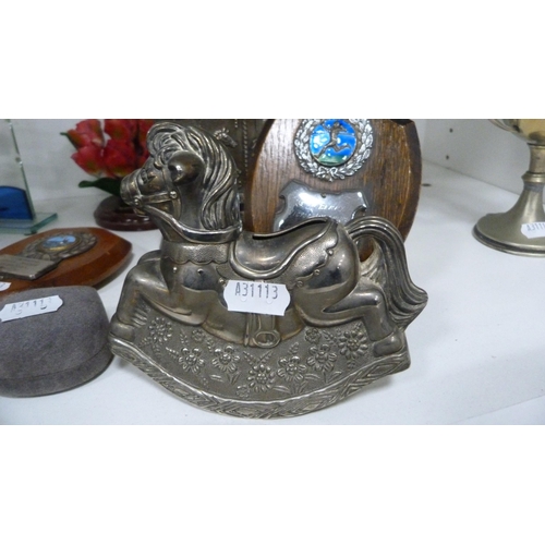 85 - Collection of trophies, Bunnykins nursery ware, rocking horse money box etc (one shelf).