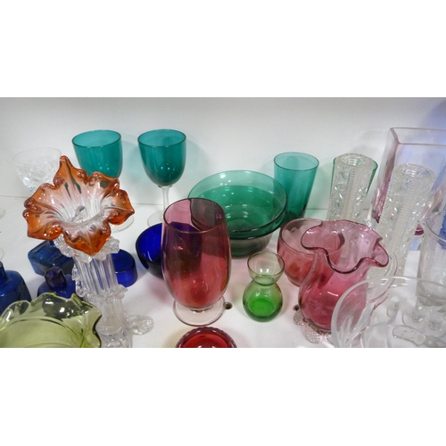 87 - Collection of coloured and other glassware to include cranberry and green glass, jugs, vases, finger... 