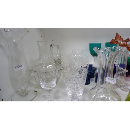 87 - Collection of coloured and other glassware to include cranberry and green glass, jugs, vases, finger... 