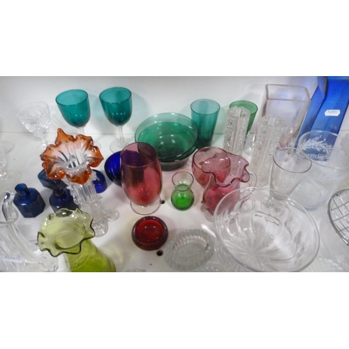 87 - Collection of coloured and other glassware to include cranberry and green glass, jugs, vases, finger... 