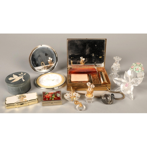 153 - A collection of powder compacts, pill boxes etc