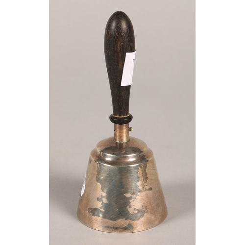 165 - A silver hand bell with turned wooden handle marked rubbed 13cm high