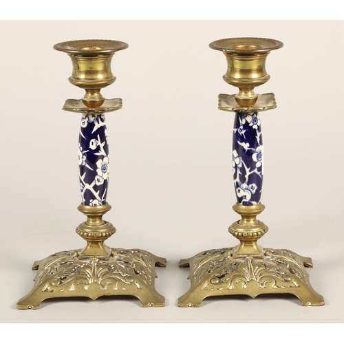 166 - A pair of brass and porcelain mounted table candlesticks 17cm high