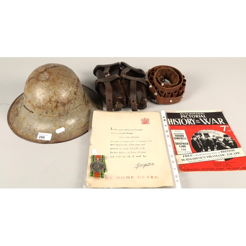 286 - Various items of military interest to include army helmet, leather bandolier, various Hutchinson's P... 