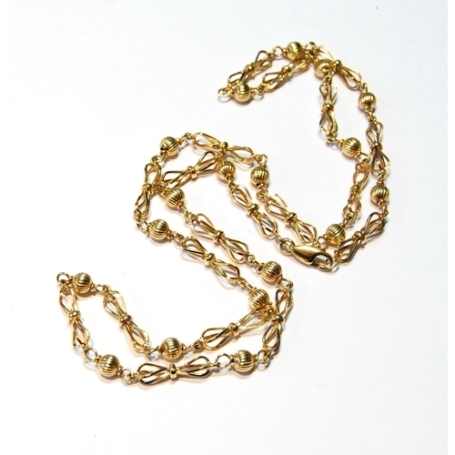 65 - 9ct gold necklet of figure of eight and reeded ball links, 19.5g.