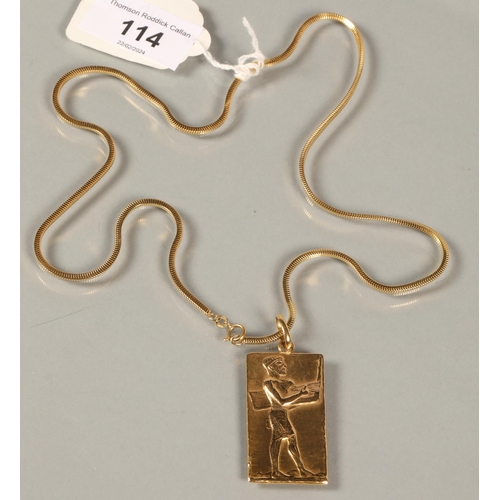 114 - 18ct gold Egyptian pendent with a 18ct gold chain, stamped 750, 33 grams