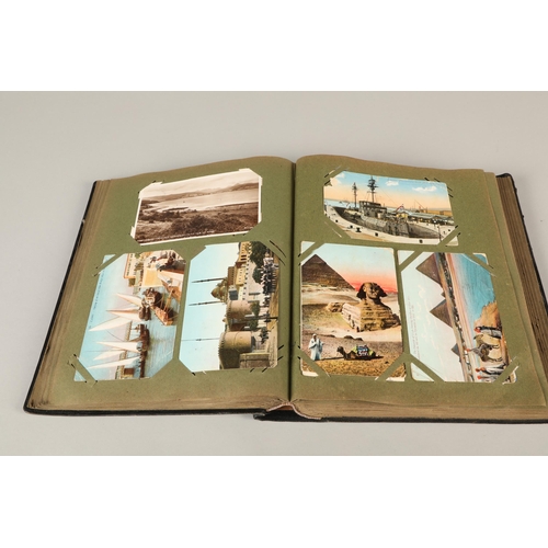 212 - A postcard album containing war related cards, topographical etc