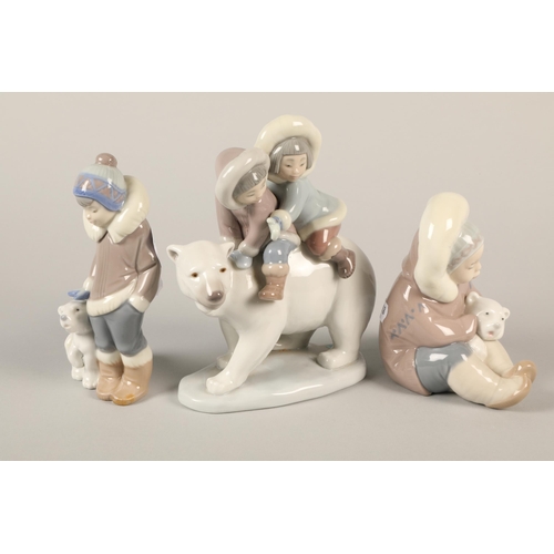 22 - Three assorted Lladro figures with polar bears.