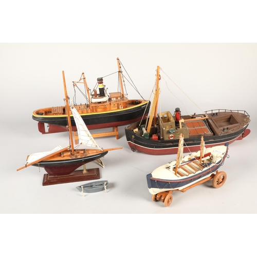 340 - Four assorted wooden boat models