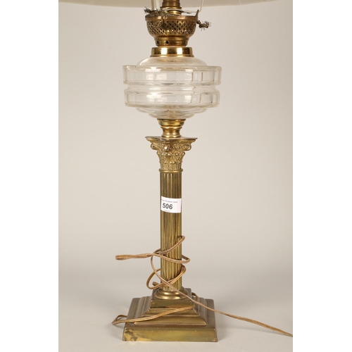 506 - Lamp with brass base and glass neck