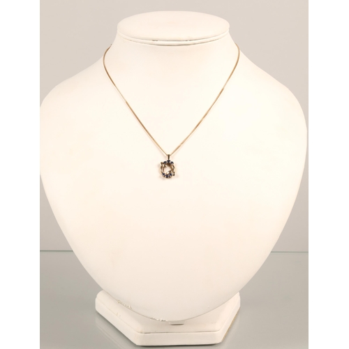 87 - 9 ct gold chain with 9 ct gold pendant set with sapphires .Total weight 3.8 grams