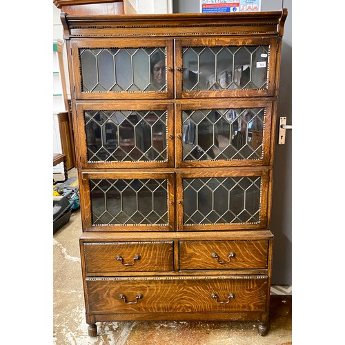 555 - leaded glass sectional bookcase.H 150cm, W 89cm, D 28.5cm