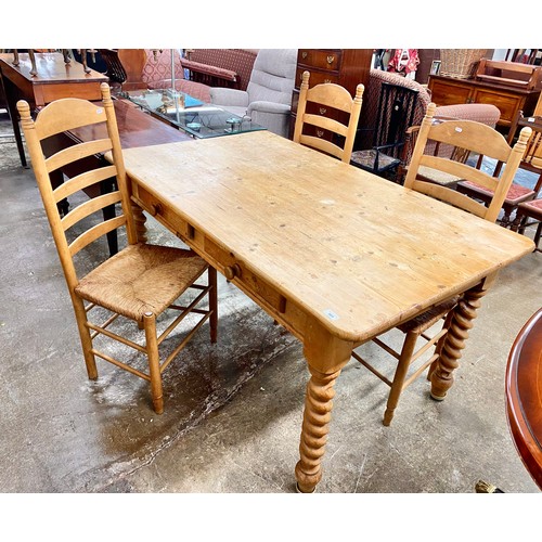 569 - Pine kitchen table with fitted drawers and three chairs, H 78cm, W 152cm, D 90cm... 