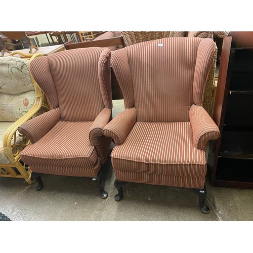 636 - Pair of striped upholstered wingbacked chairs (2)