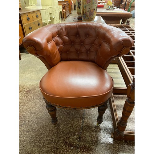 557 - Leather button back armchair