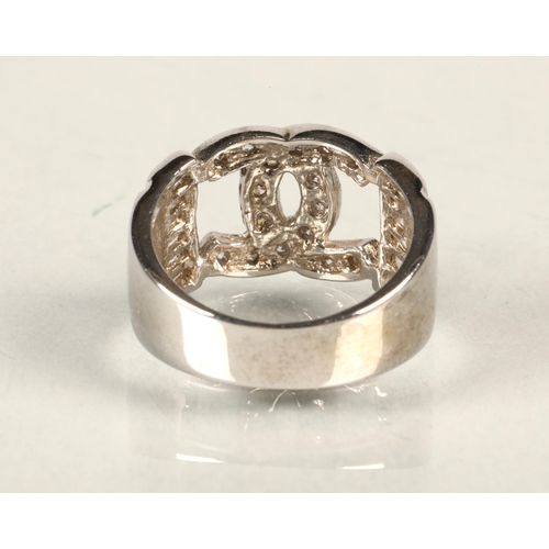 71 - Silver ring with intertwinned Cs with white stones