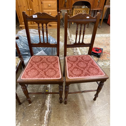 585 - Two carved occasional chairs with pink floral upholstery, 88cm height