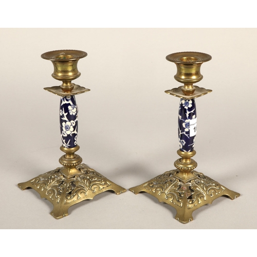 166 - A pair of brass and porcelain mounted table candlesticks 17cm high