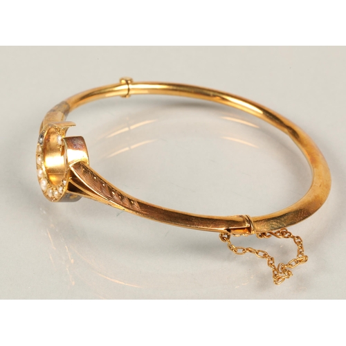 78 - 9 ct gold bangle with moon and star , with seed pearls, 5.6 grams total weight