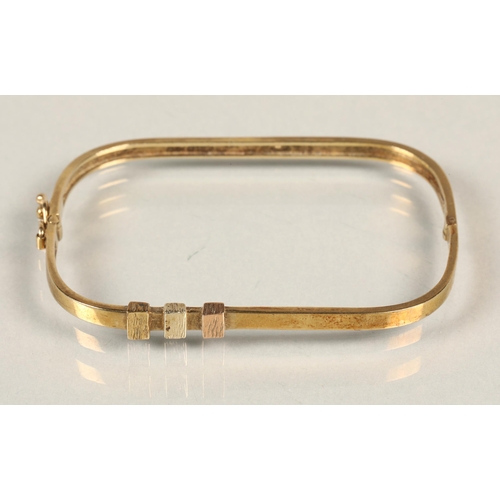 82 - 9 ct gold rectangular bracelet, with three coloured gold square detail, 8 grams