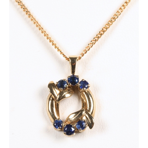 87 - 9 ct gold chain with 9 ct gold pendant set with sapphires .Total weight 3.8 grams