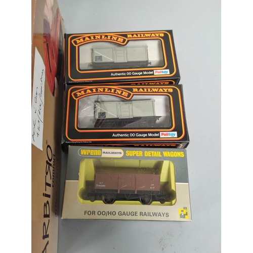 199 - Box containing a collection of 00 gauge rolling stock to include Esso tankers, covered wagons and ot... 