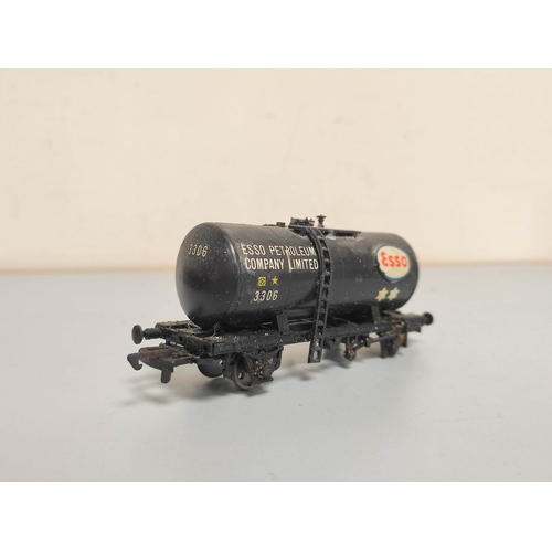 199 - Box containing a collection of 00 gauge rolling stock to include Esso tankers, covered wagons and ot... 