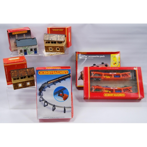 281 - Group of Hornby OO gauge railway accessories and track to include R8084 Trakmat accessories pack, R.... 