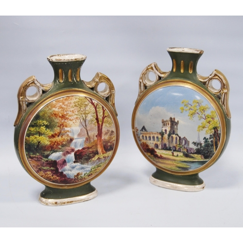 224 - Pair of Aesthetic Movement moon flasks by Charles Barlow bearing pictorial images of Jedburgh Abbey ... 