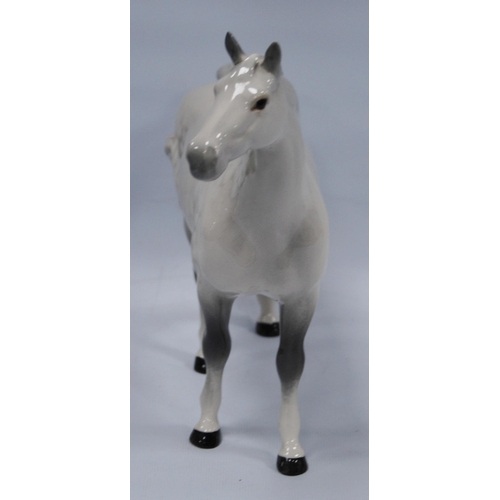 225 - Beswick model of a dapple grey horse, 21.5cm high.