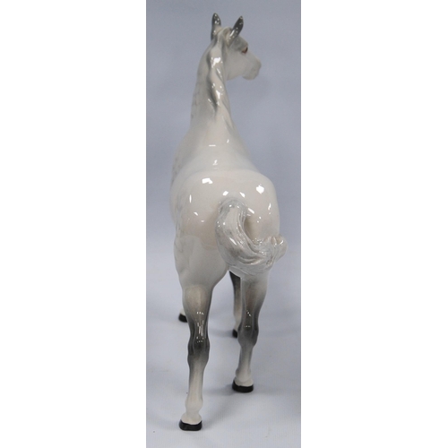 225 - Beswick model of a dapple grey horse, 21.5cm high.