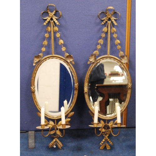 415 - Pair of gilt metal girandole wall mirrors in the 18th century style, each with floral and ribbon sur... 