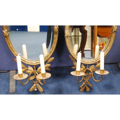 415 - Pair of gilt metal girandole wall mirrors in the 18th century style, each with floral and ribbon sur... 