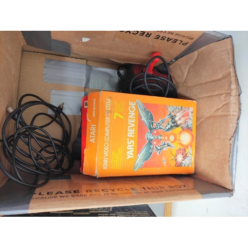 136 - Boxed Atari video computer system, model CX-2600A with accessories and games to include Missile Comm... 