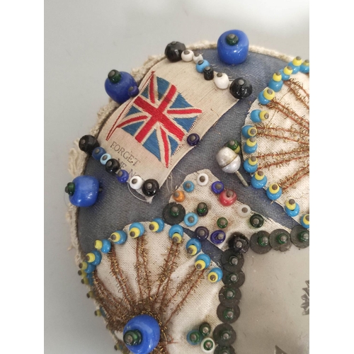 358 - WW1 sweetheart beadwork pin cushion in the form of a heart having Union Jack flag details, and a cen... 