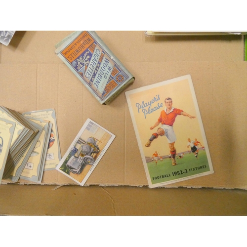 214 - Box of various postcards and collectable cigarette cards.