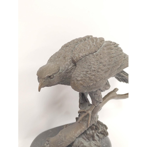 393 - 20th century cast bronze sculpture of a bald eagle, perched on naturalistic branch and on shaped pli... 