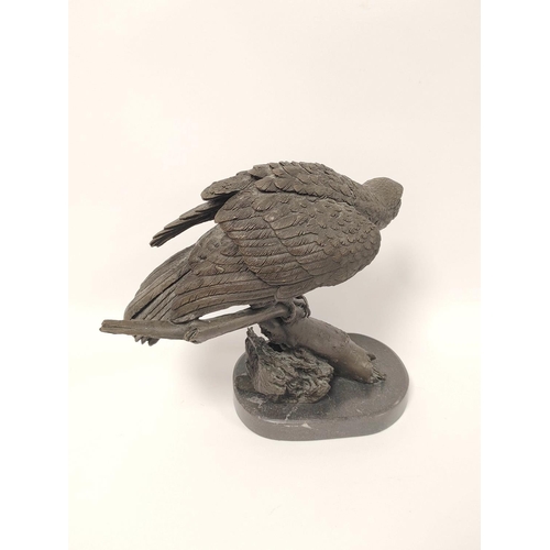 393 - 20th century cast bronze sculpture of a bald eagle, perched on naturalistic branch and on shaped pli... 