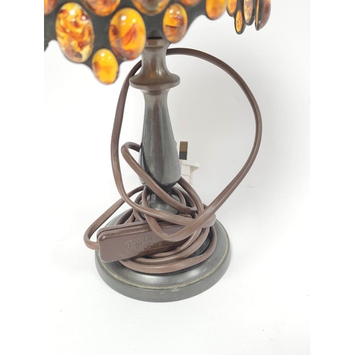 444 - Tiffany style table lamp, the shade with overall inset amber beads, on knopped stem and circular foo... 