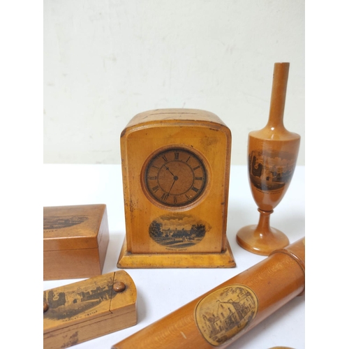 389 - Group of Mauchline wares to include coin bank with clock face, scroll holder, napkin ring, box etc, ... 