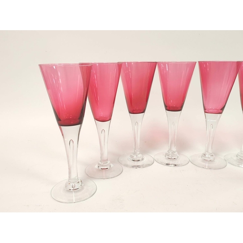 415 - Set of eight cranberry cocktail glasses, each with large trumpet shaped bowl on clear glass stem and... 