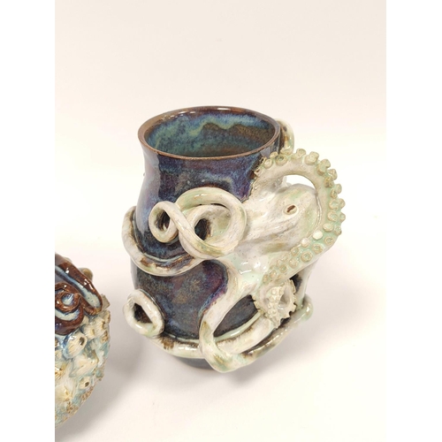 340 - Two Studio pottery vases (Hexham?) each decorated with moulded octopus, drip glazed in blue, decorat... 