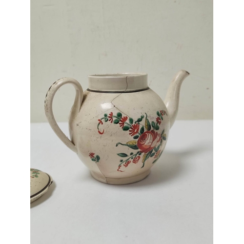 338 - Late 18th century English creamware globular teapot, cracking & other damages, painted with flow... 