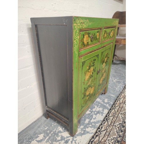 495 - Indian style green painted and lacquered decoupage cupboard with two small drawers above cupboard ba... 