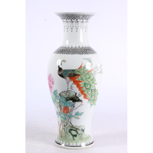 122 - Modern Chinese baluster vase decorated with peacocks, 30cm high.