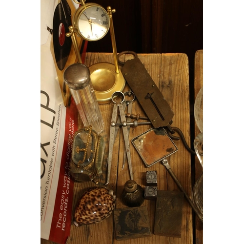 138 - Curios to include a gilt metal pocket watch casket, a silver top toilet bottle, a cowrie shell, prin... 