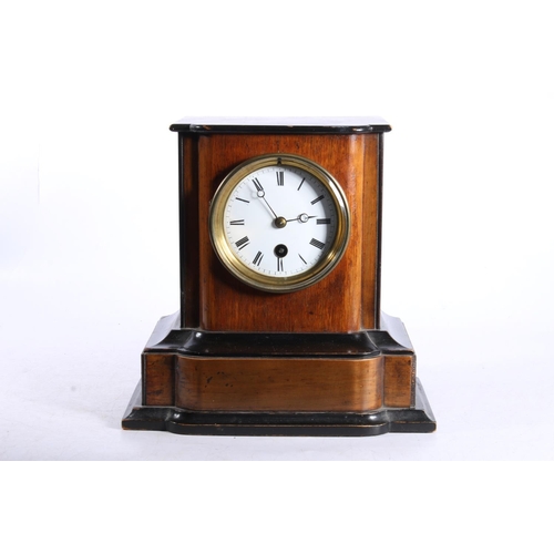 142 - Mahogany cased mantel clock, 22cm high.