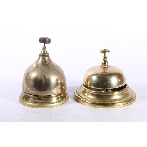 169 - Two brass desk bells.