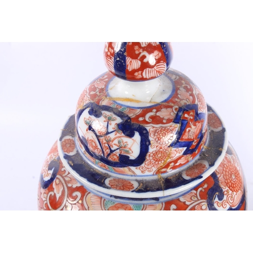 189 - Pair of oriental Imari baluster temple jars and covers, 30cm high.