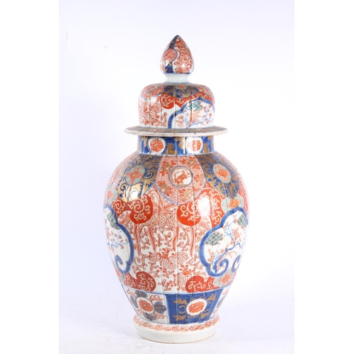 190 - Oriental pumpkin shaped baluster Imari temple jar and cover, 30cm high.